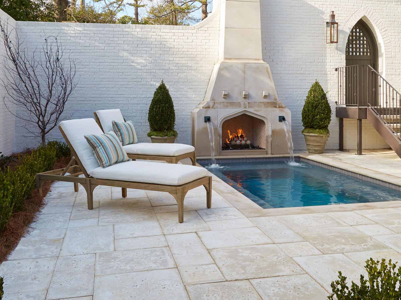 Peacock Pavers Outdoor Fireplace above pool