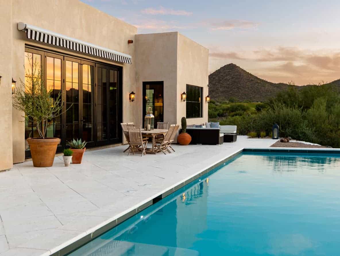 Rice White pavers surround a pool at a desert home in Arizona