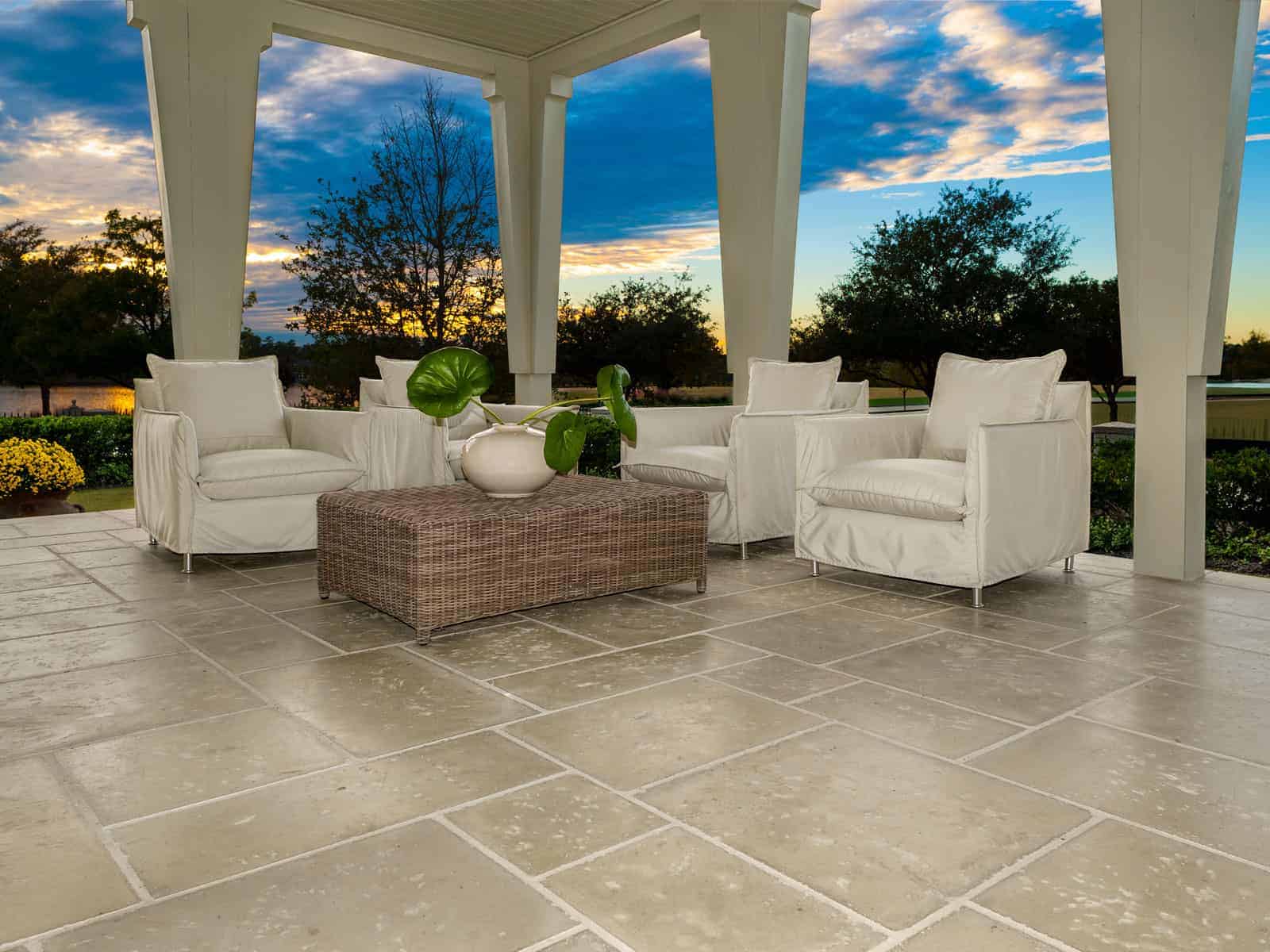 Large format concrete patio pavers mixed in a pattern with regular-sized pavers