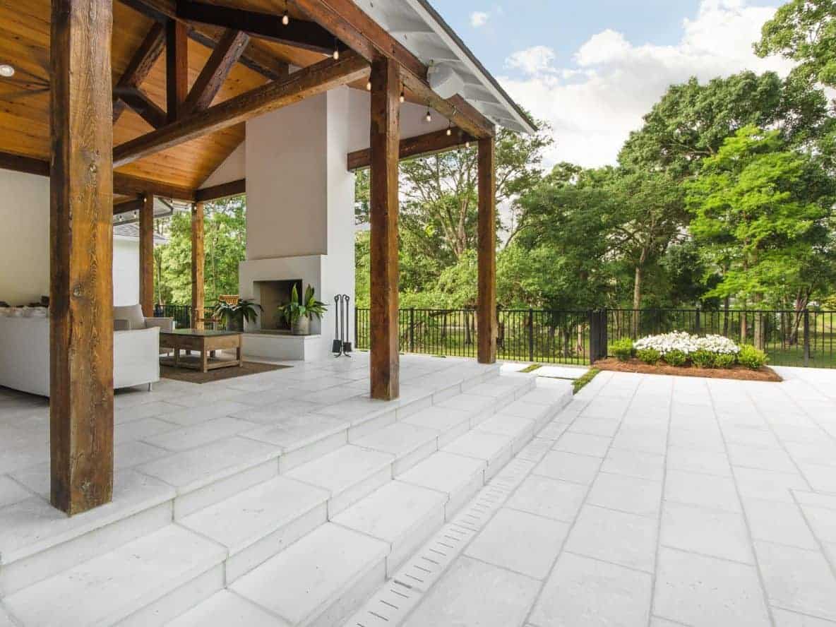 A wooden exterior pavilion with Rice White concrete pavers.