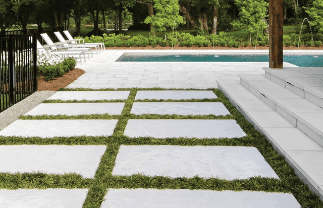 Concrete paver pool patio with grassy joints